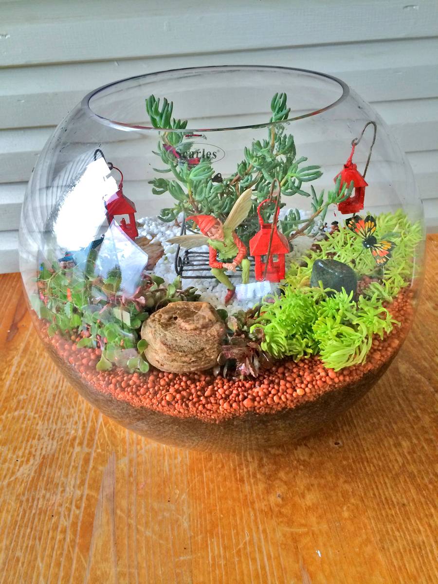 Miniature Terrarium Fairy Garden finished in a large round glass fish bowl