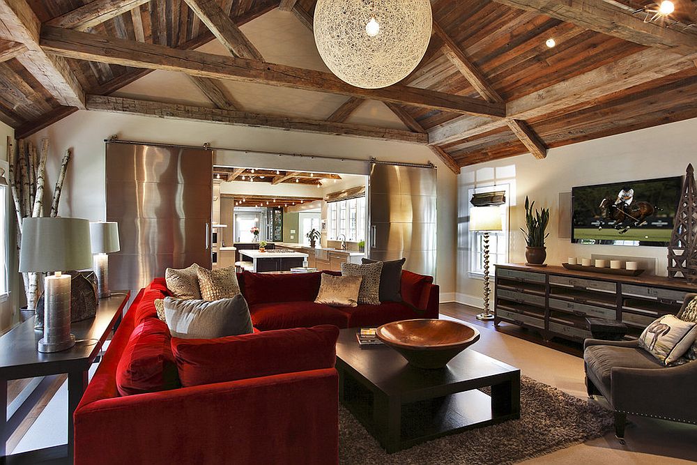Rustic living room with red couch and spacious interior [Design: Callaway Architects]