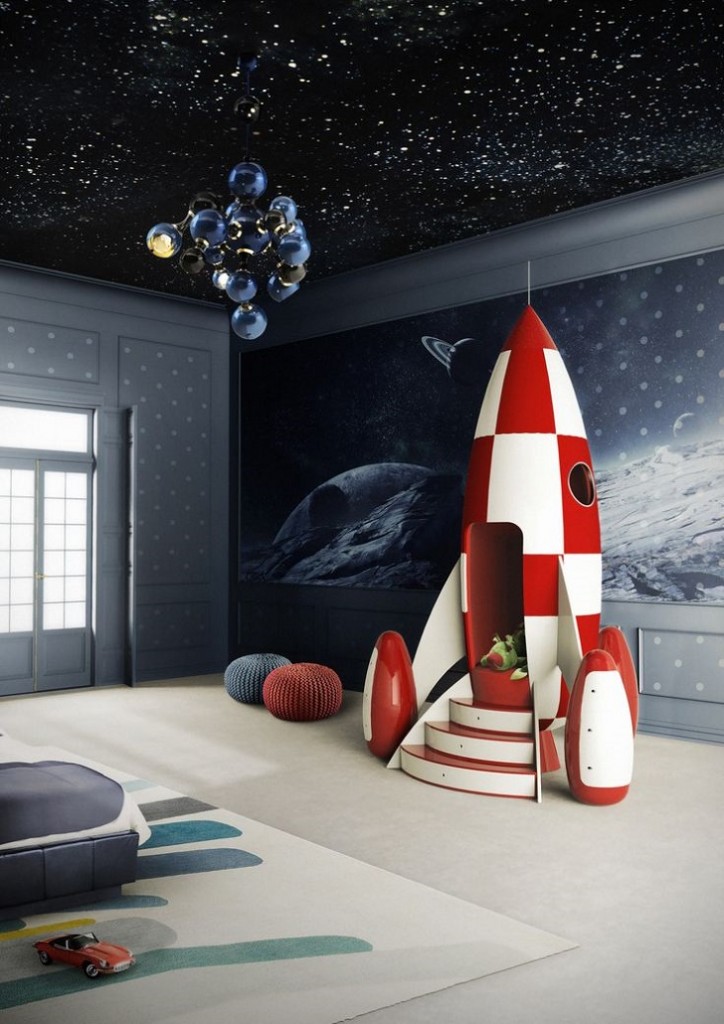 A space-themed bedroom with a rocket, star-themed ceiling, and outer space on the walls.