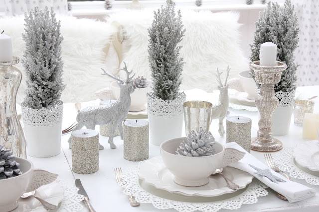 white christmas table with faux greenery white dishes reindeer
