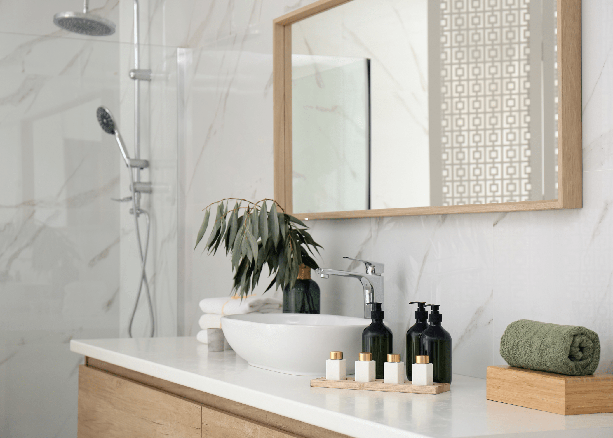 modern bathroom with wood frame mirror bowl sink and white countertops